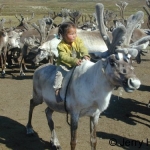 Girl on totem reindeer