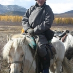 Jerry on a horse, wearing a del