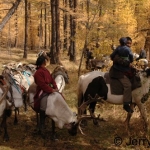Reindeer riders in a larch forest