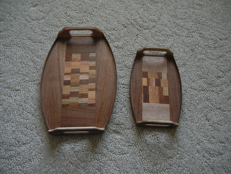 Two small trays with curved edges